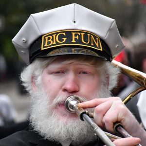 Whitebeard man playing trumpet