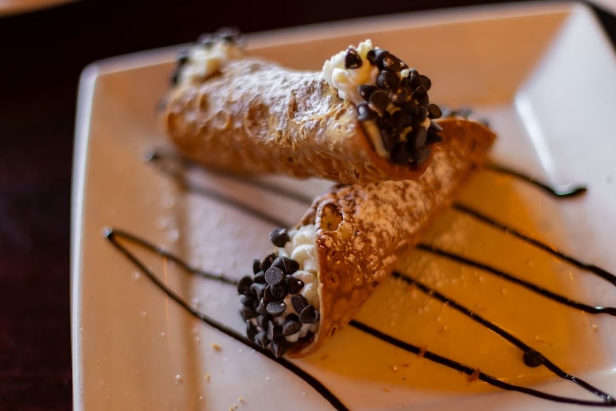 Cannoli: Crispy Sicilian pastry shells filled with sweet seasoned creamy ricotta.