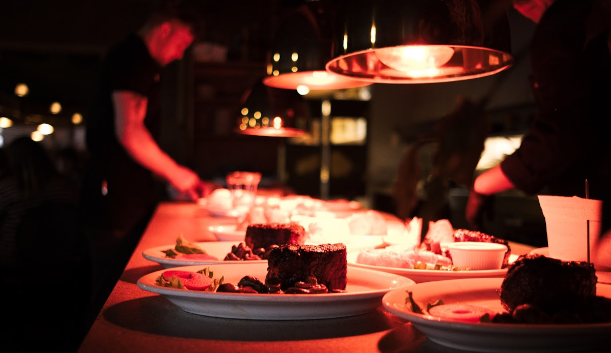 Assorted dishes on a dimly lit table