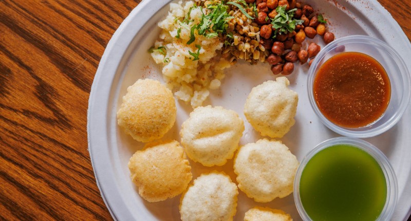 pani puri served with spicy potato, black chickpeas, sprouted beans