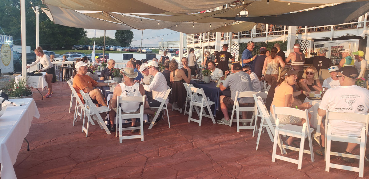 People seated at tables on the restaurant terrace