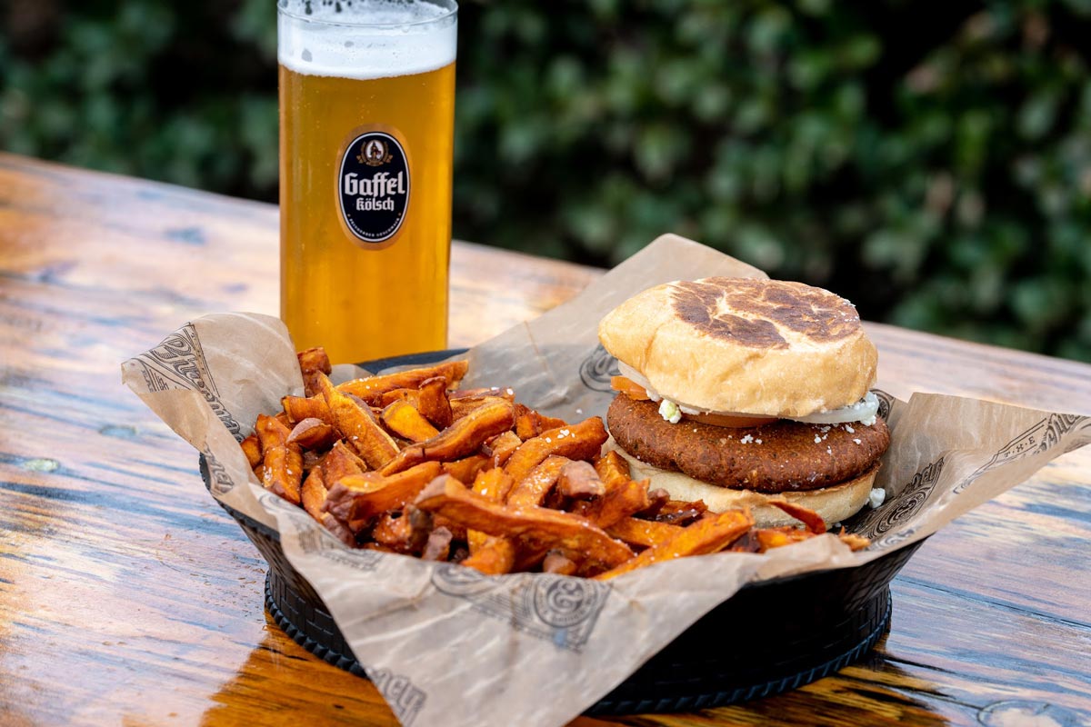 Falafel burger and fries served with beer