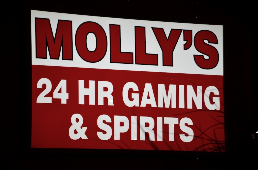 Molly's Gaming and Spirits billboard
