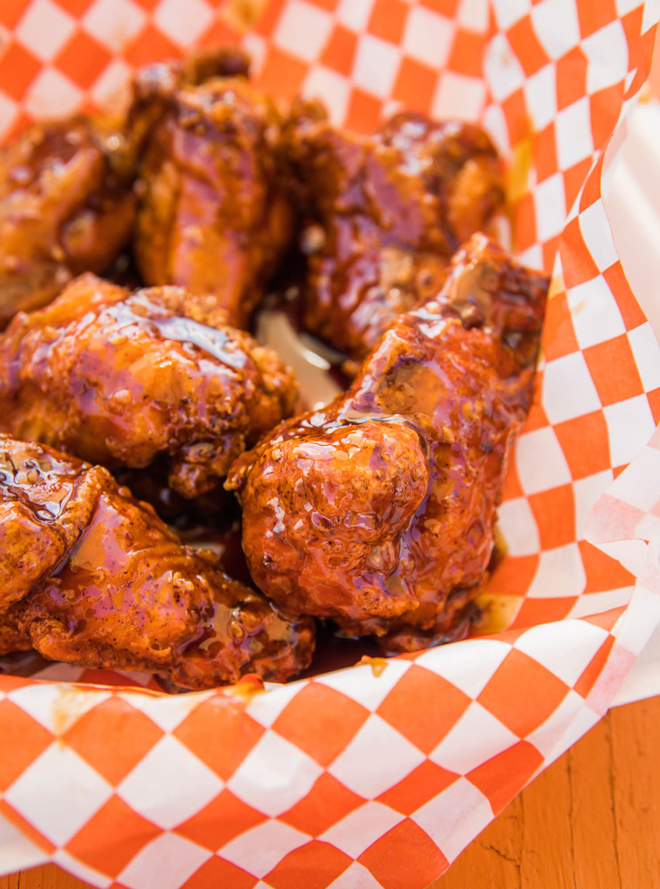 saucy glazed chicken wings in Austin with sticky sweet and spicy sauce