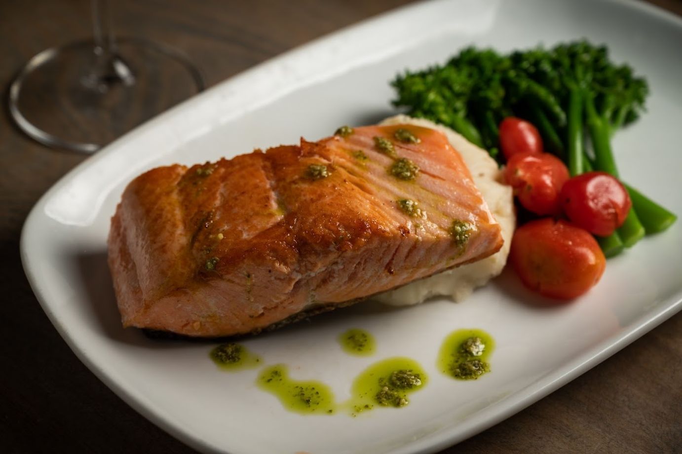 Pan-seared salmon, mashed potatoes, broccolini and cherry tomatoes