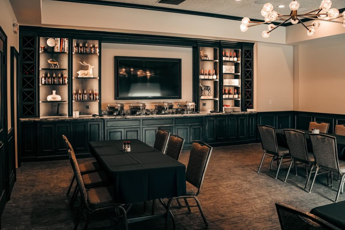 Room with a black table and chairs