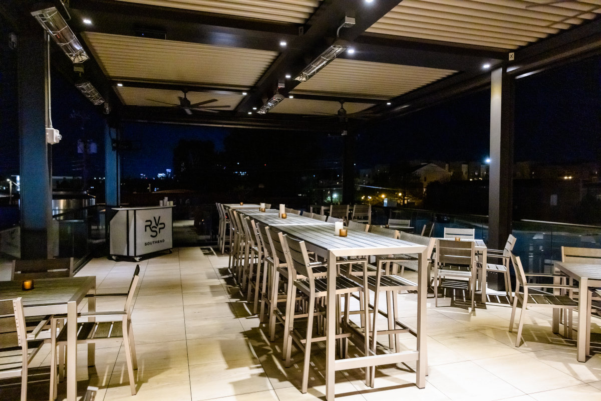 Exterior, seating area, high tables and chairs, night