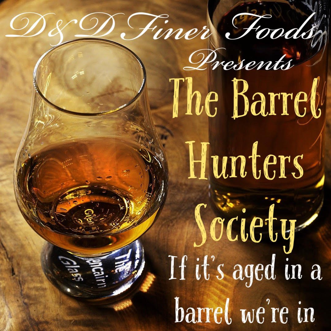 Whiskey glass and bottle with The Barrel Hunters Society text