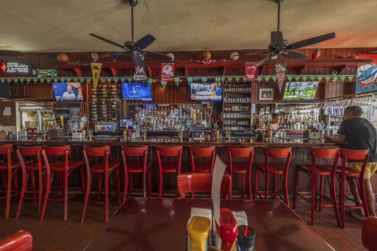 The bar at Norman’s Tavern with TVs showing live sports
