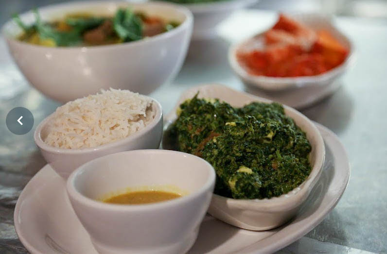 Saag spinach dish with rice and soup