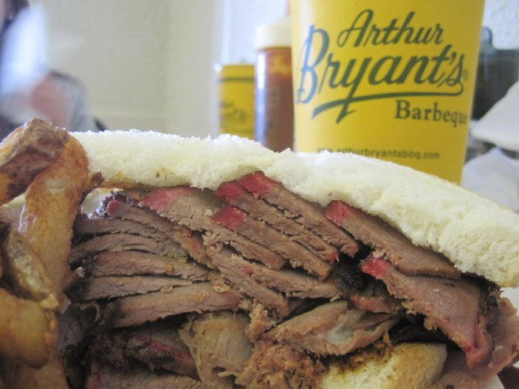 Tasty meal with the Arthur Bryant’s Barbeque sign in the background