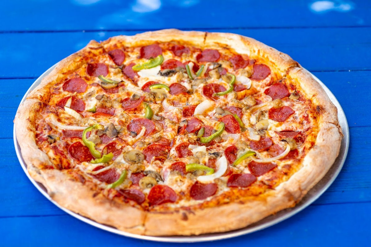 Pepperoni and green pepper pizza, served