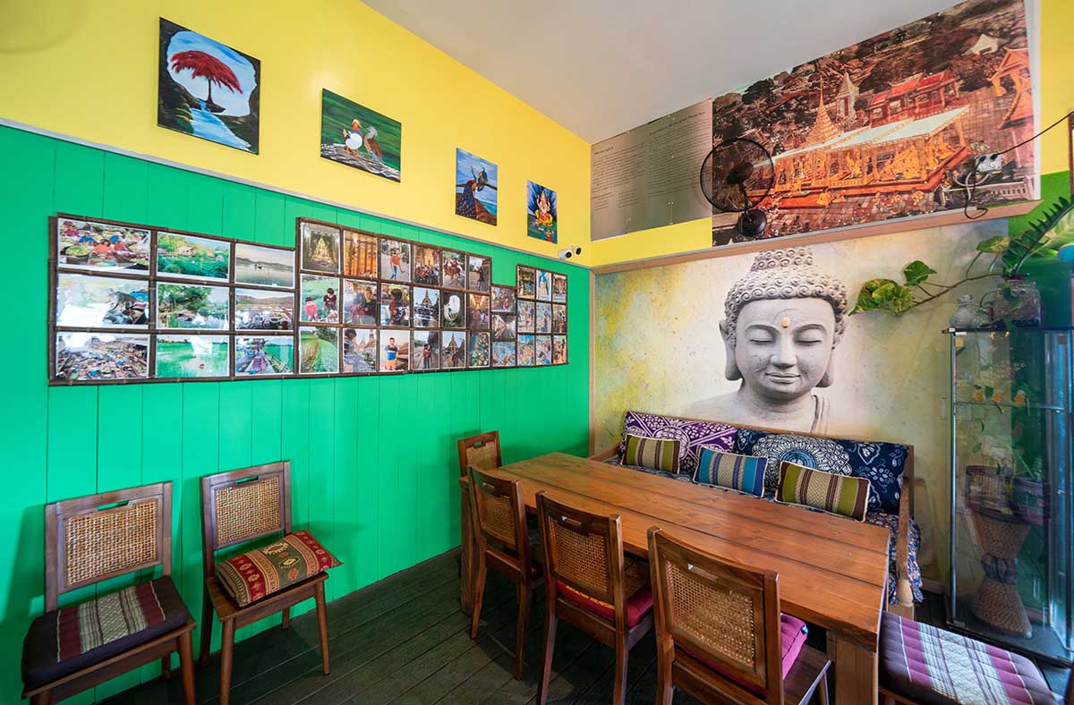 Interior, tables, chairs, photos and murals on the walls