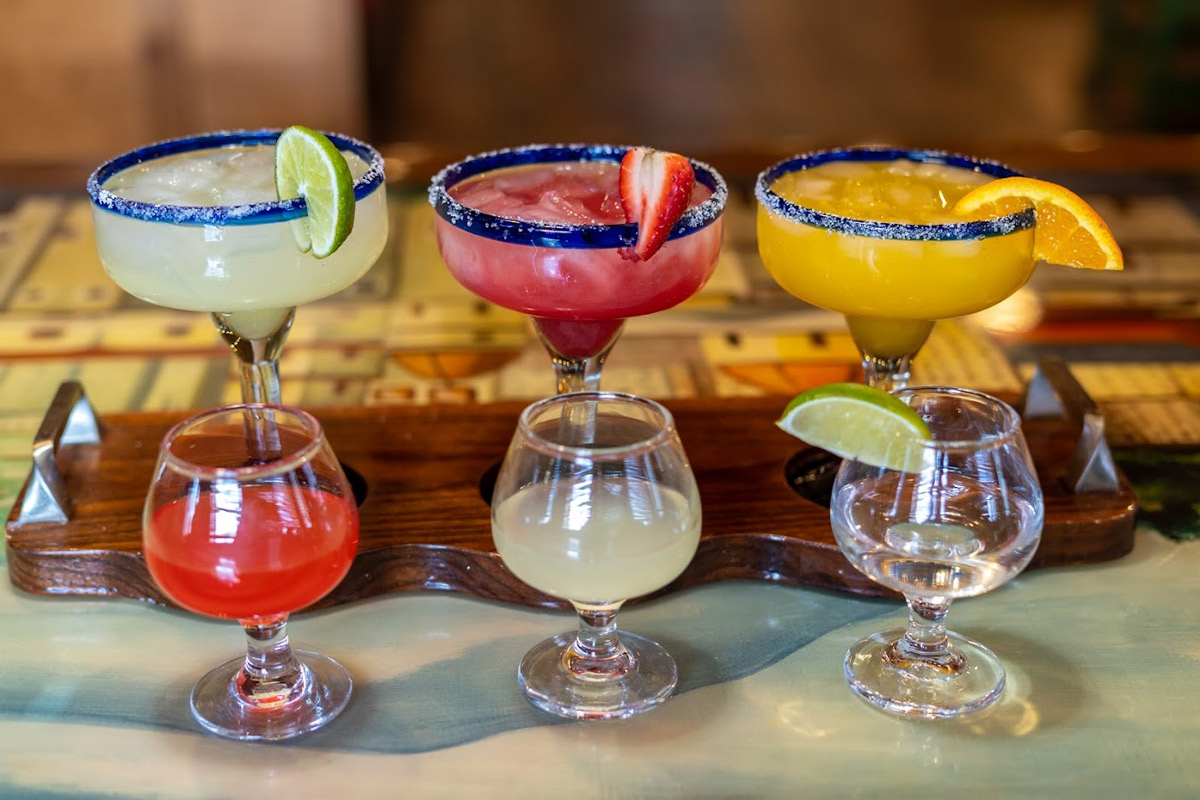 Margarita flight with drink shots in front