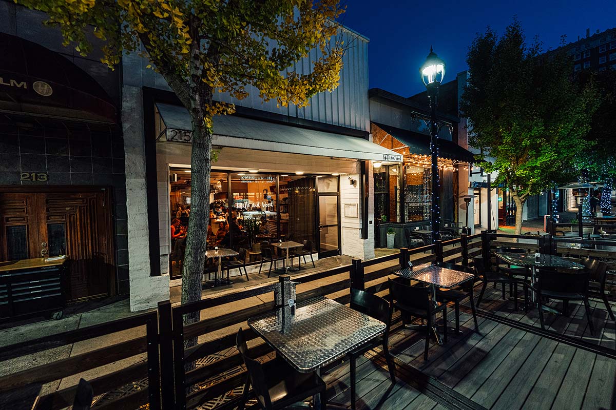 Outdoor patio at night, the restaurant building