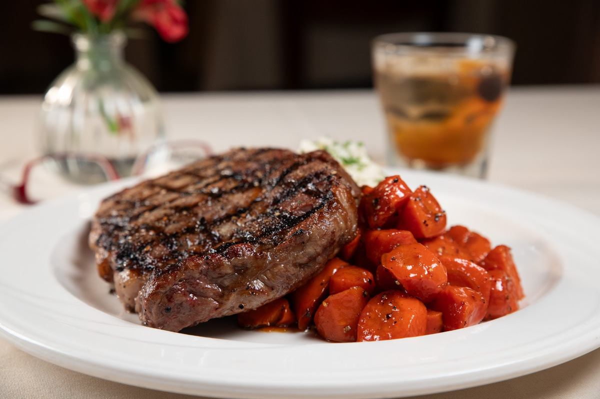 Grilled Ribeye steak, with mashed potatoes and glazed carrots