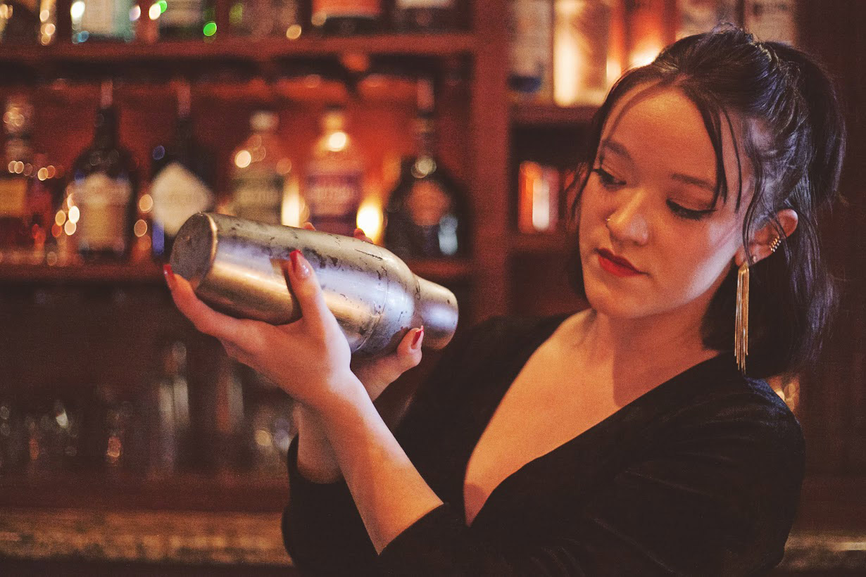 A photo of the bartender holding a shaker