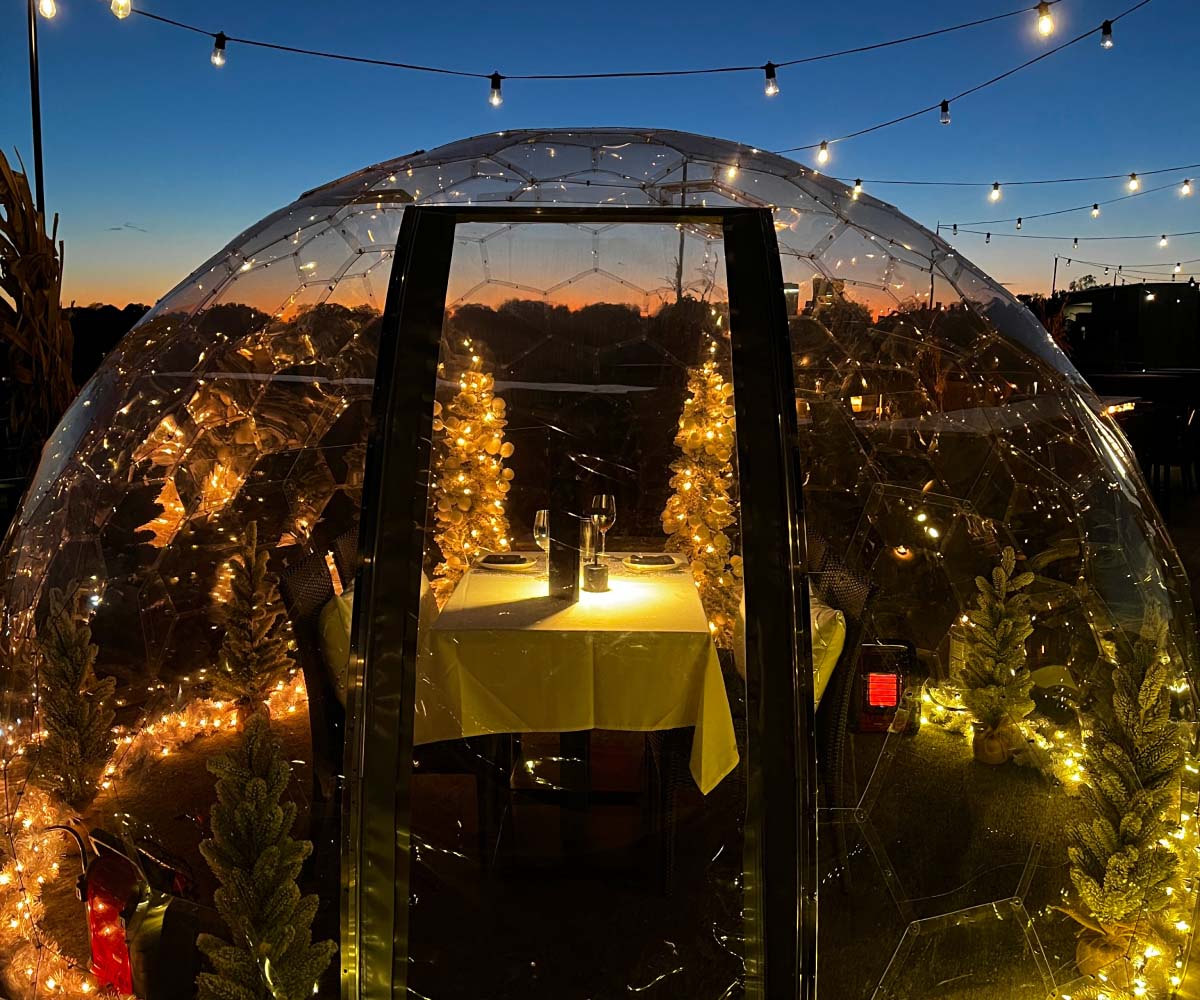 Dining table under a dome tent, evening