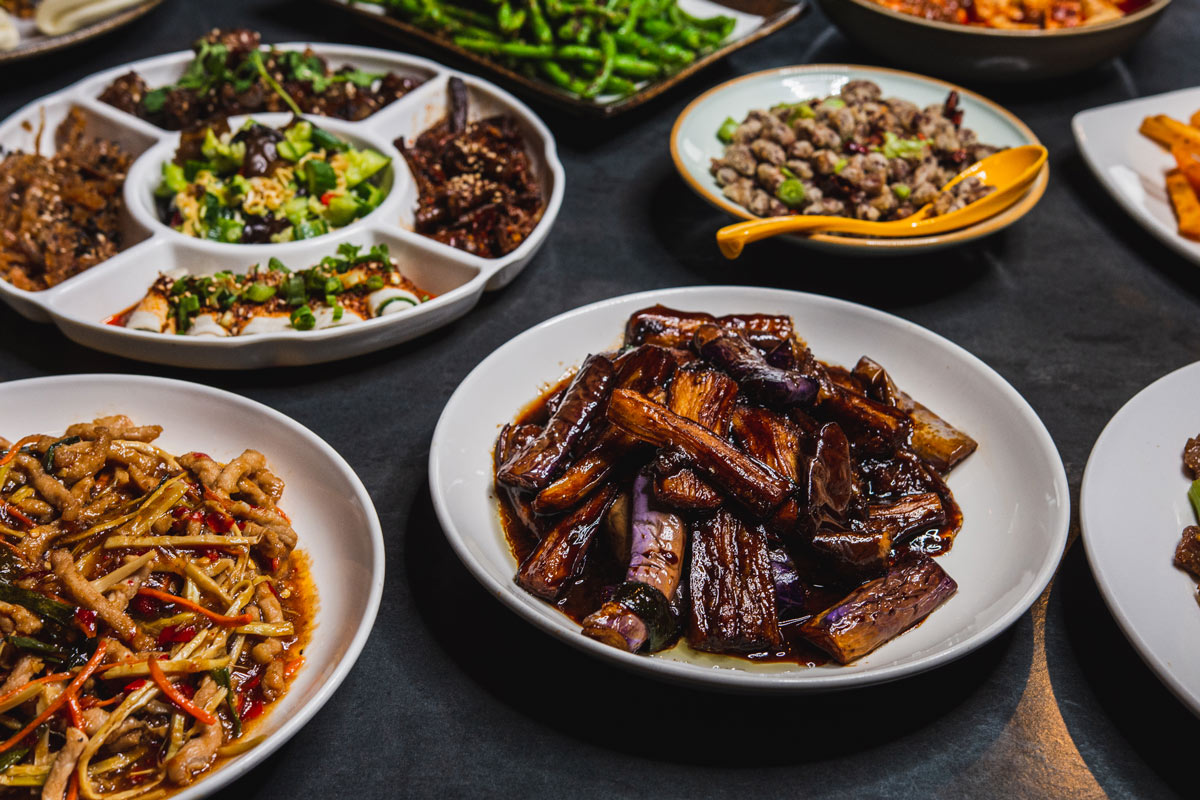 Different type of dishes served on a table.