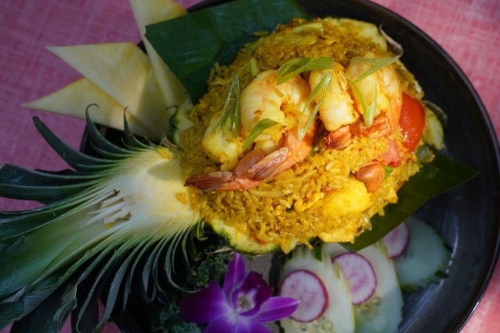 Fried rice with shrimp, served on pineapple half 