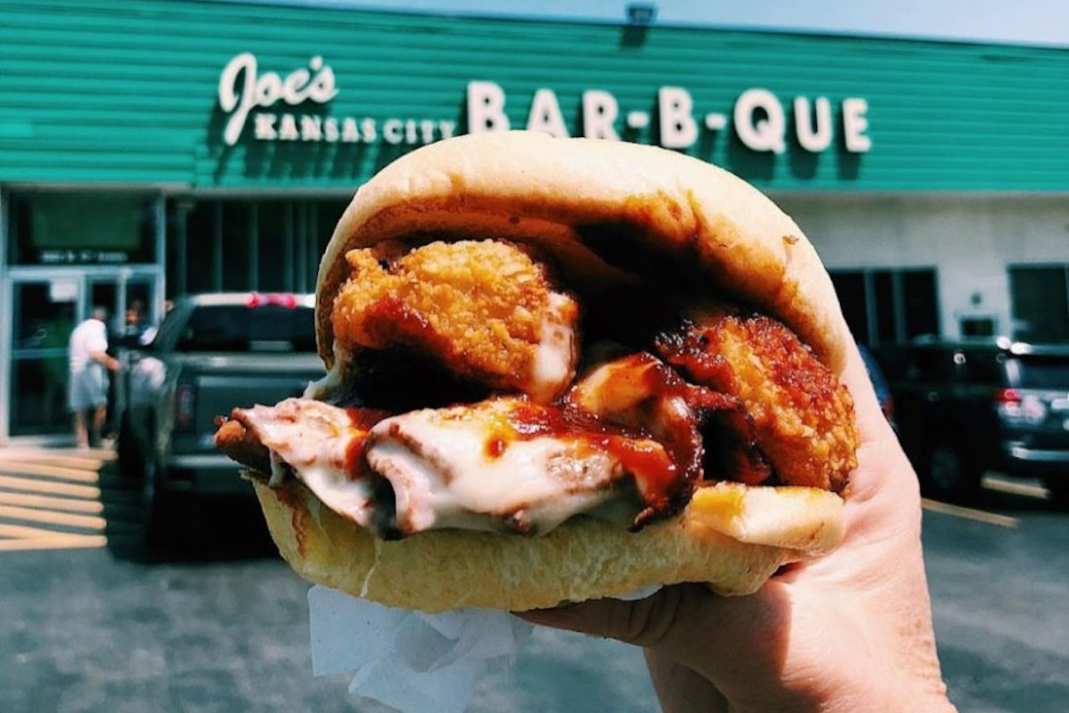 Outside Joe�s Kansas City Bar-B-Que, chicken sandwich in hand