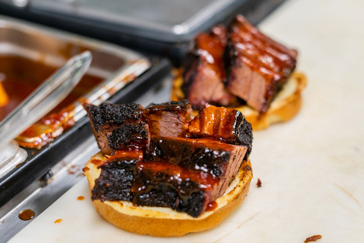 Burnt ends on grilled bread, close up
