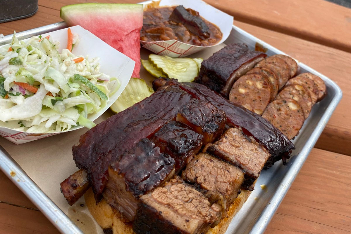 BBQ meat platter with side dishes