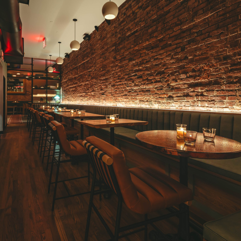A cozy restaurant with brick walls and neatly arranged tables photo